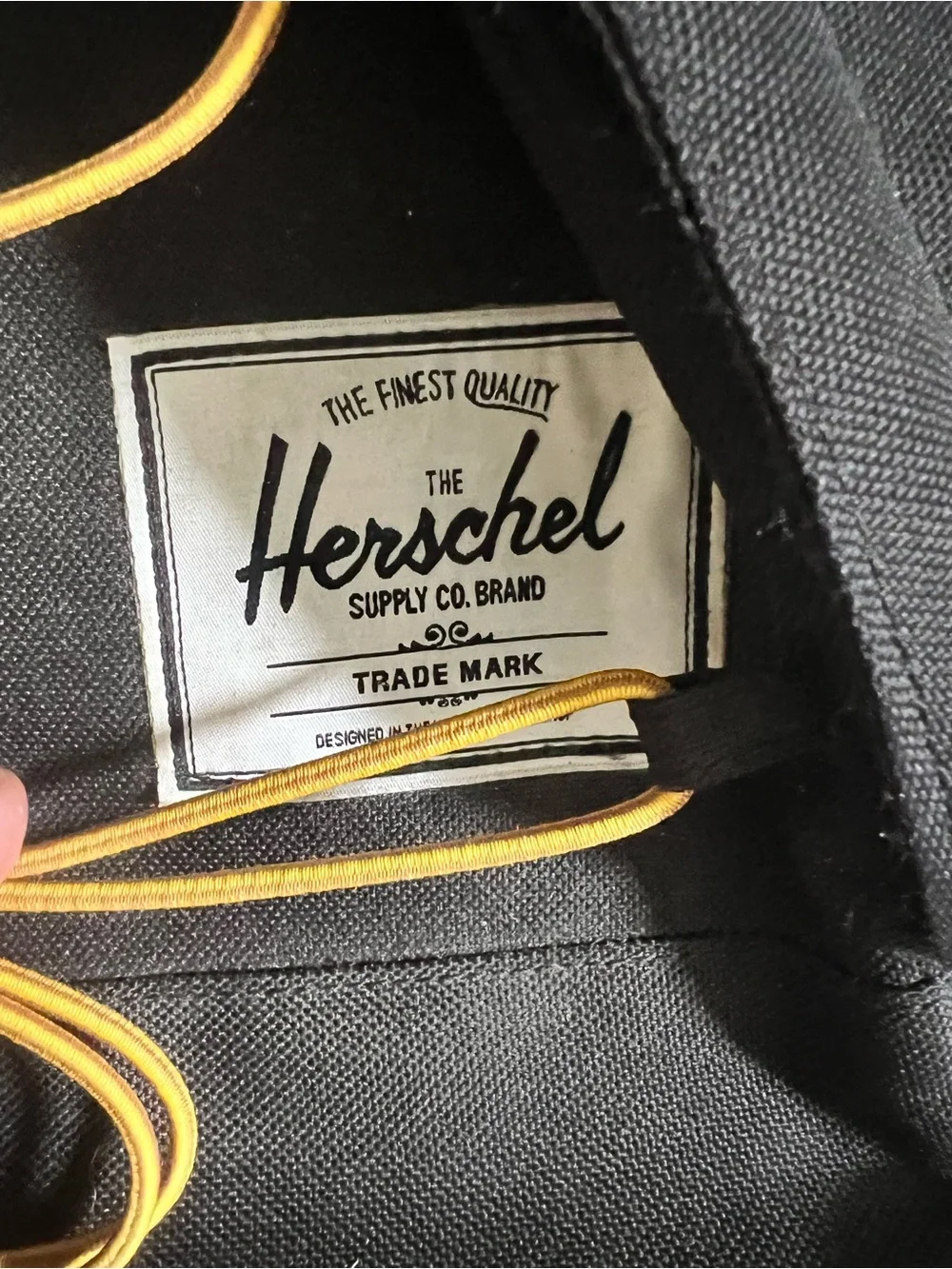 Herschel Black Backpack with Yellow Cord